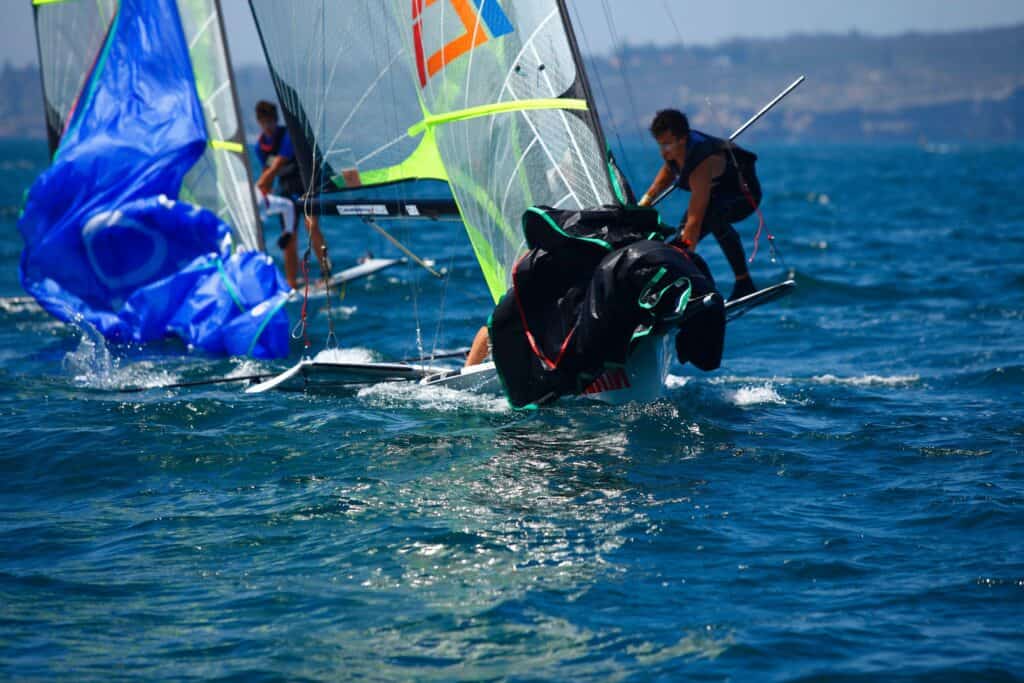 Sailors racing sailboats at Woollahra Sailing Club on a sunny day.