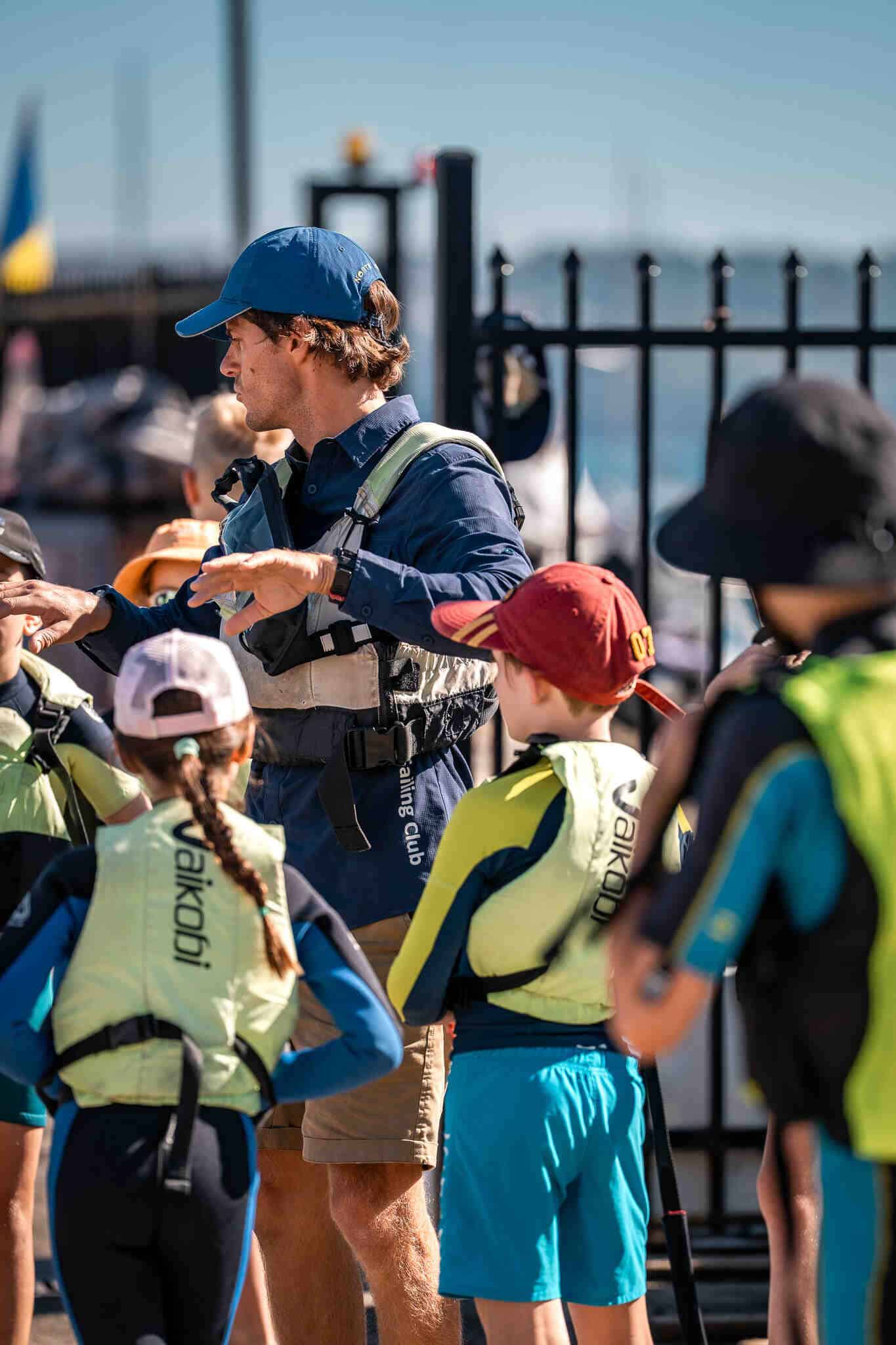 Family and kids at Woollahra Sailing Club preparing for sailing activities.