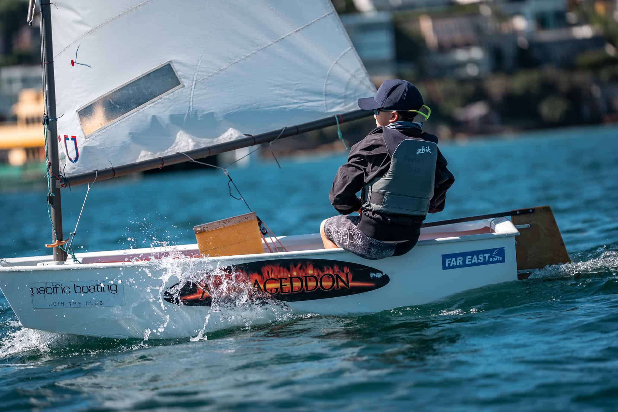 Young sailor in a small boat at Woollahra Sailing Club, Sydney.