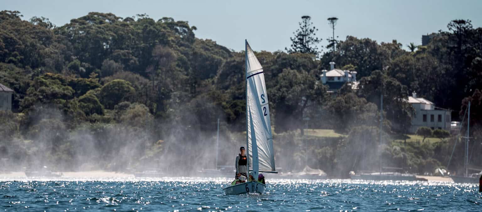 Woollahra Sailing Club member preparing a high-performance surf ski for a paddling session on Rose Bay