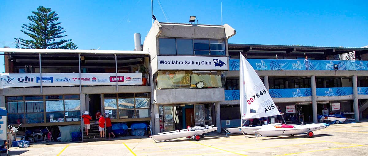 Woollahra Sailing Club with boats and sailboats on Sydney Harbour.