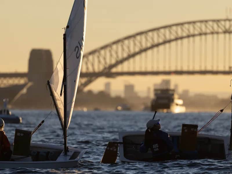 Sailboats racing on Sydney Harbour during summer regatta at Woollahra Sailing Club.